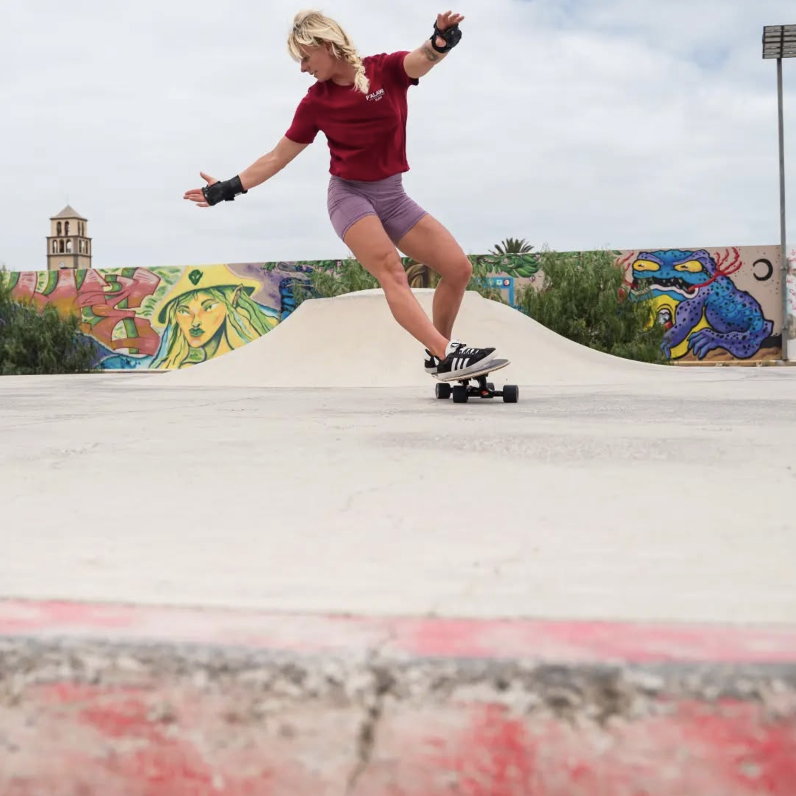 Woman riding a surfskate in a skate park – surfskate lessons in Fuerteventura
