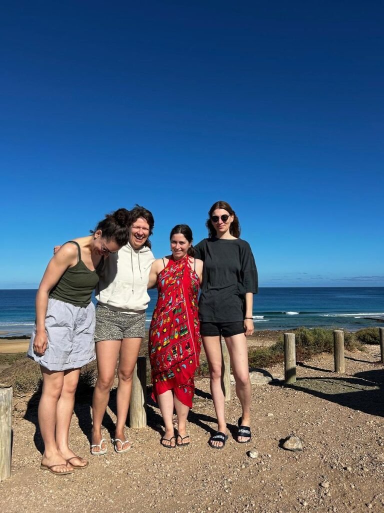 Group of happy surf students on the beach after a lesson in Corralejo